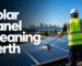 Solar panel cleaning Perth technician washing rooftop solar panels with purified water
